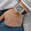 Richard Mille RM 030 rose gold skeleton automatic 50mm men's watch on wrist and hand in jeans pocket