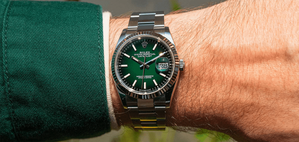 Green Rolex Datejust watch on wrist