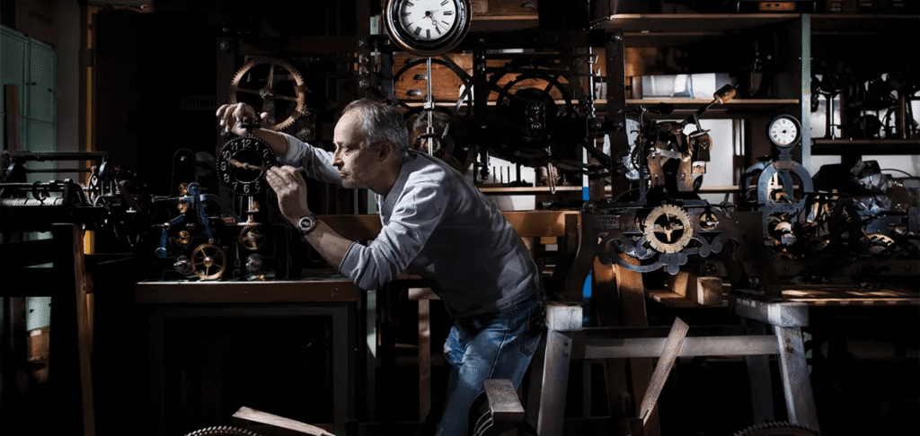 Independent watchmaker working on traditional mechanical watchmaking